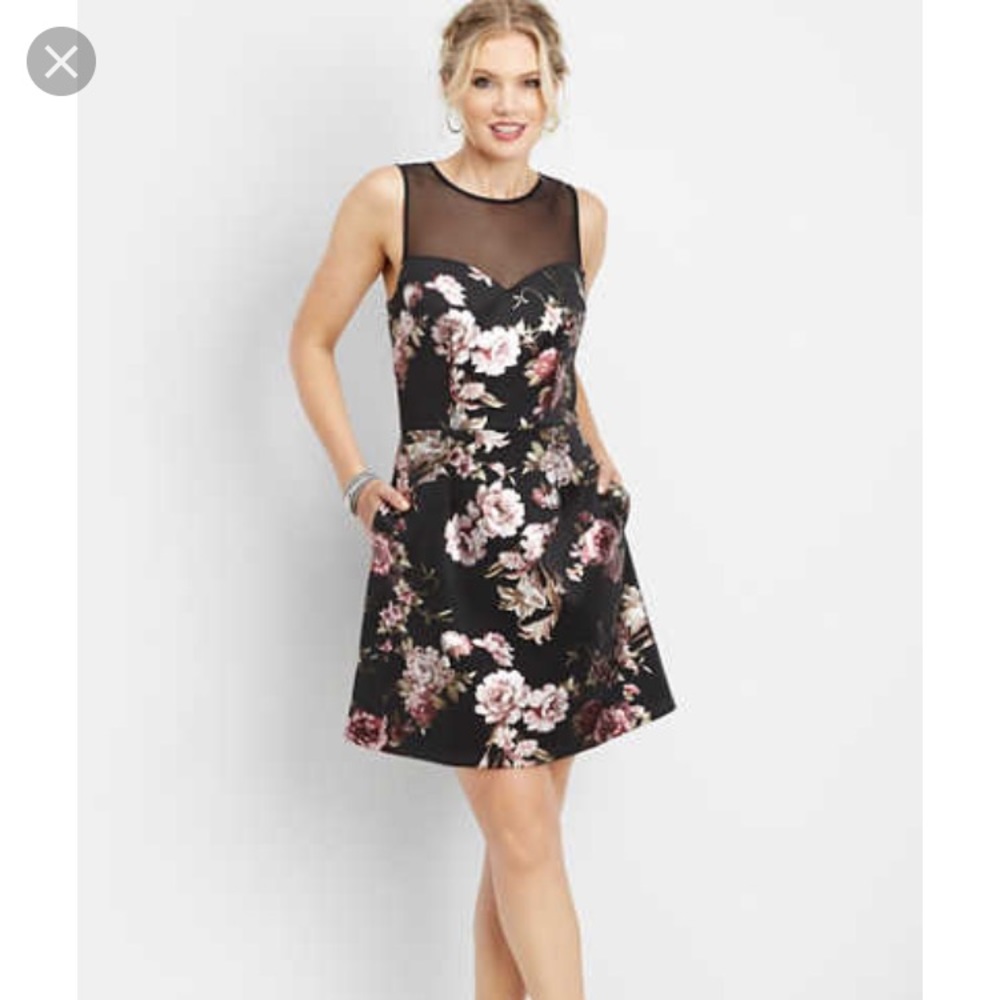 Black floral dress with sheer neckline.